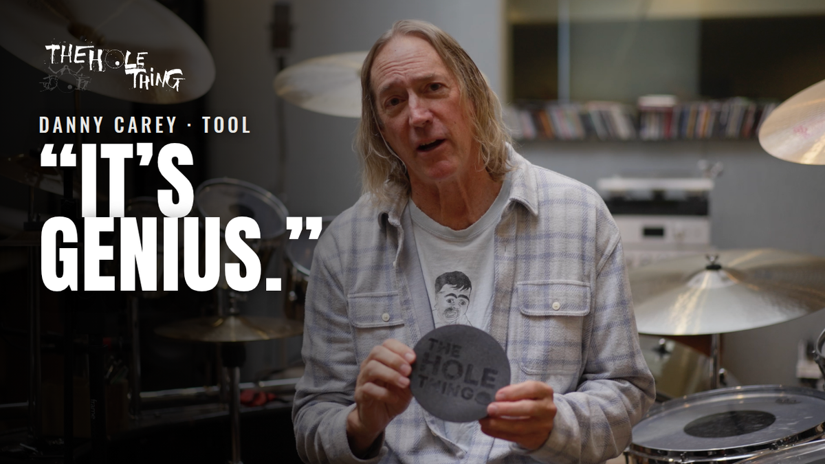 Load video: Here you go — descriptive but concise (good for screen readers and if the video ever fails to load):Danny Carey of Tool, seated at his drum kit, holds up The Hole Thing bass drum porting insert and calls it genius.